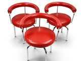 trois chaises rouges aux pieds chromés et au dossier rond