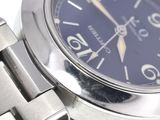 a close up of a wrist watch with a blue face