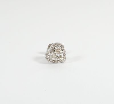 a close up of a diamond ring on a white surface
