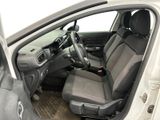 the interior of a car with the door open showing the driver ' s seat