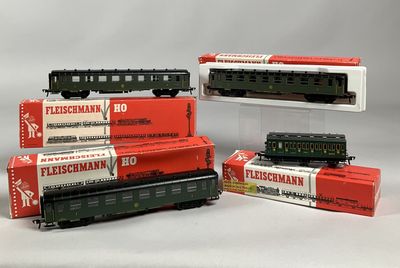 several model trains are stacked on top of each other on display
