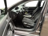the interior of a car with the door open and the driver ' s seat down