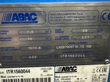 a close up of a blue machine with a label on it