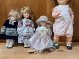 three dolls that are standing next to each other on the floor