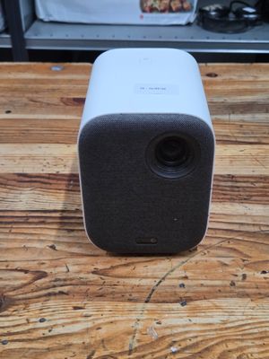an apple speaker sitting on top of a wooden table