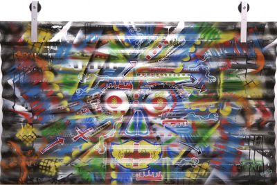 a painting on the wall of a building that has graffiti on it