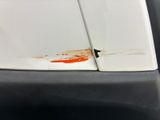 a close up of a white surfboard with blood on it