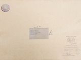 an old envelope with a stamp on it sitting on top of a table