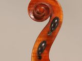 an antique violin with a wooden back and bow