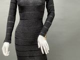 an image of a mannequin dressed in a black and white striped dress