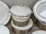 a lot of plates and bowls stacked on top of each other