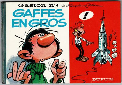 une image représentant un album de bande dessinée avec, en arrière-plan, l'illustration d'un homme et d'une fusée
