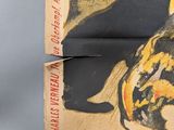 a picture of a cat sitting on top of a book