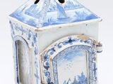 a small blue and white box with a picture on it