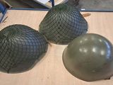 three helmets that are sitting on a table