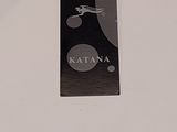 a black tag with a picture of a cat on it