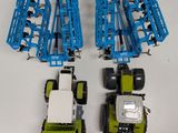 four toy trucks that are sitting next to each other
