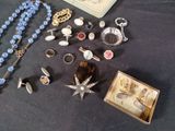 a lot of jewelry sitting on a table together