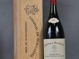 an image of a bottle of red wine next to a wooden box