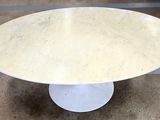 an image of a white marble table with a white pedestal