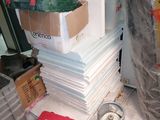 a pile of boxes and other items on a table