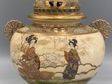an image of a vase with a woman and a bird on it