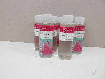 three bottles of hand sanitizer sitting on a counter top
