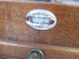 a close up of a drawer with a clock on it