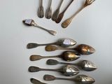 a lot of silver spoons and forks arranged in a circle
