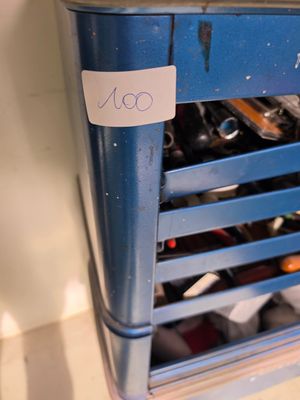 a blue bin with lots of tools in it