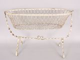 a white metal basket on a stand on a white background