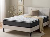 the mattress is on the bed in the room by the window