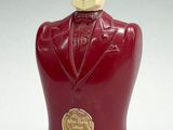a red statue of a man in a tuxedo