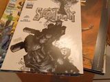 a box full of comic books sitting on the floor