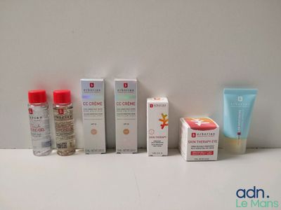 many different types of skin care products displayed on a table