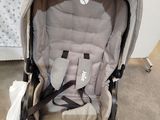 a baby stroller with a seat in the middle of it