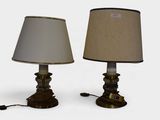 pair of antique brass table lamps with shades on each of them