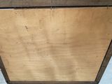 a wooden cabinet with a drawer on top of it