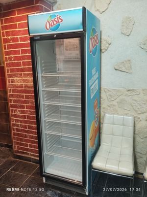 an image of a refrigerator and a chair in a room