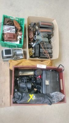 a box of assorted items sitting on the floor
