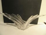 a glass bowl that is sitting on a table