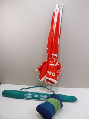 two umbrellas and a towel sitting on a table