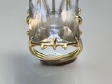 an image of a ring with a large clear stone