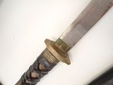 a close up of a knife on a white surface