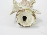 a figurine of a bird that is sitting on a table