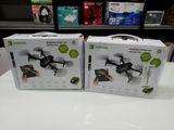 two boxes of remote controlled drones sitting on a table in a store