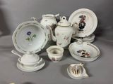 many different pieces of china on the table