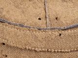 a close up of a piece of fabric with holes in it