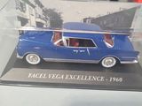 a blue car in a clear box on a table