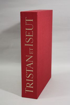 a red book sitting on top of a table next to a white background